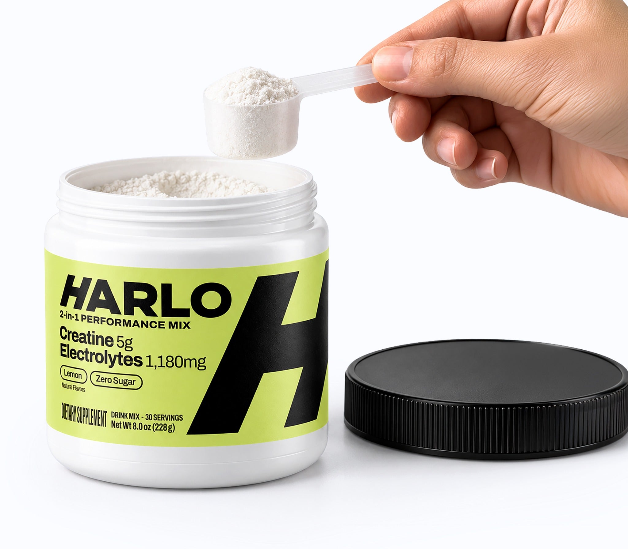 Harlo 2-in-1 Performance Mix with a hand holding one daily scoop